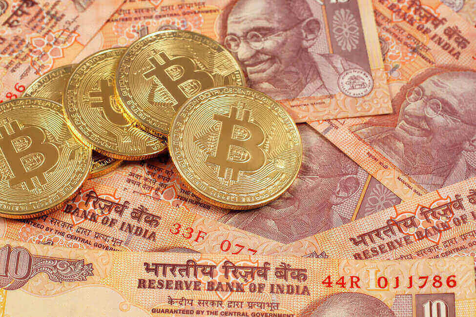 Close-up of Bitcoin with Indian rupee notes