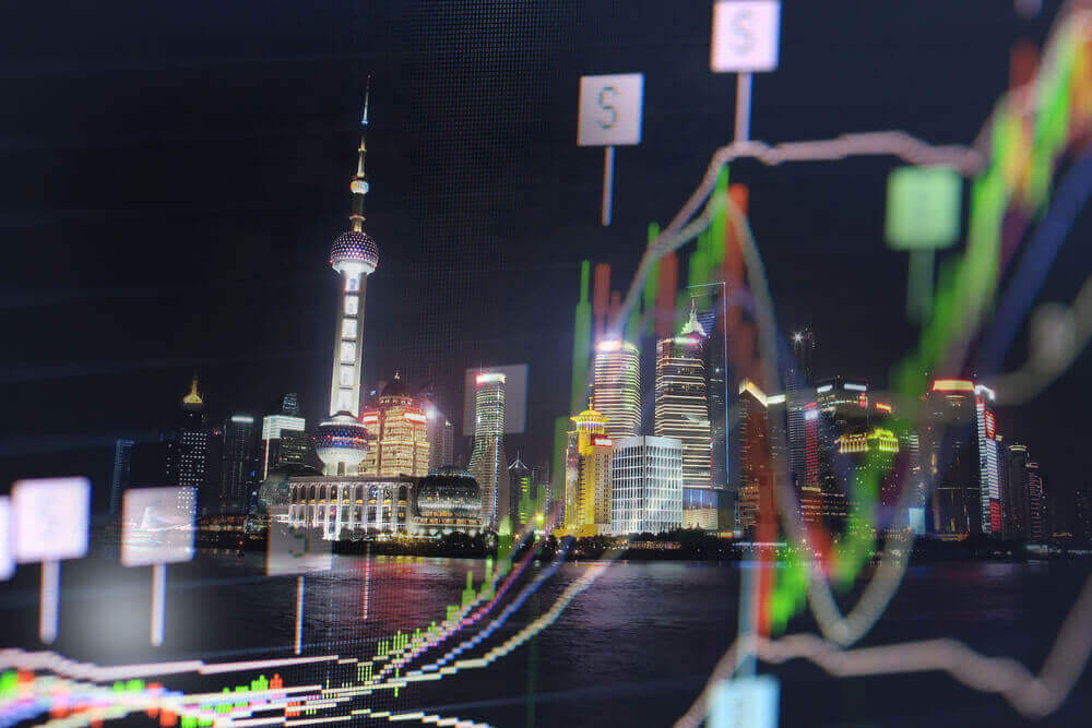stock, line graph in front of the skyline view of Shanghai, China