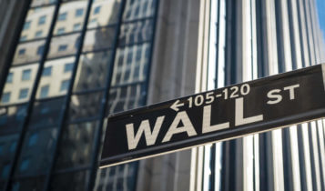 wall street sign with building background