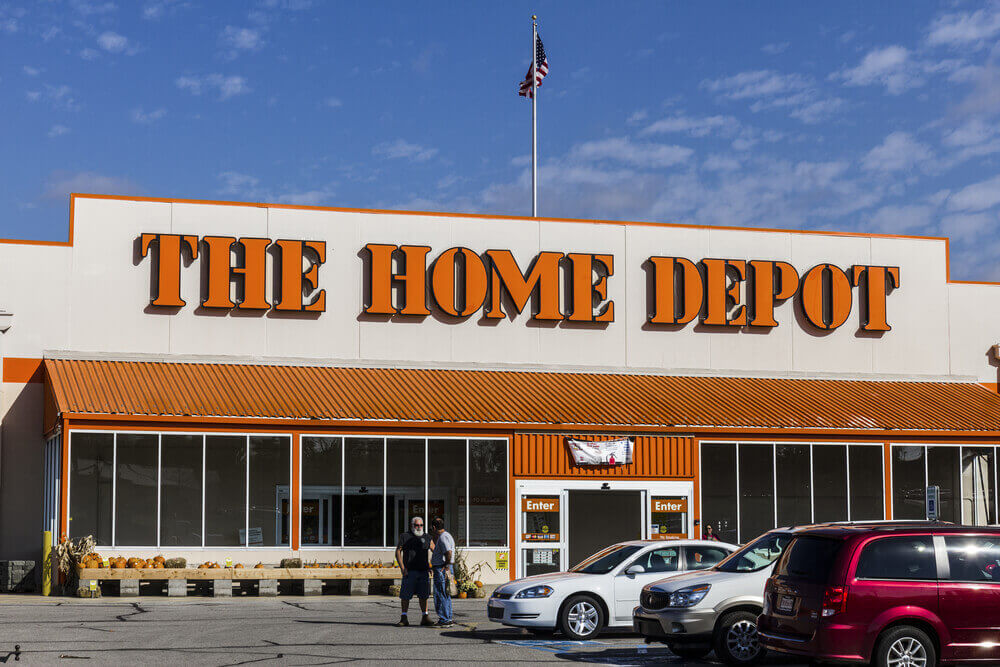 a home depot store with cars parked in front
