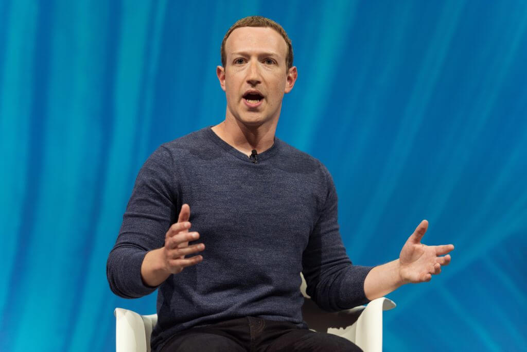 Zuckerberg speaking at a conference