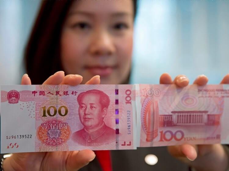 Chinese Yuan in 100 notes- Finance Brokerage