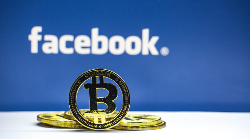 bitcoin token in front of facebook logo