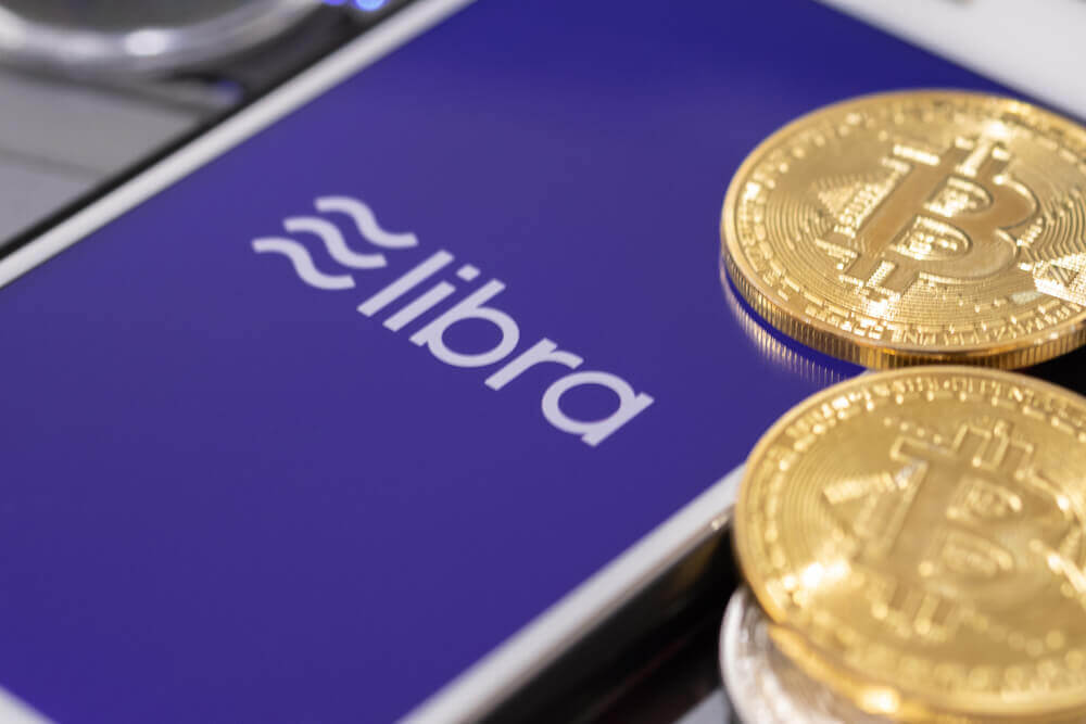 Finance Brokerage – Digital Coins: Libra word and bitcoin.