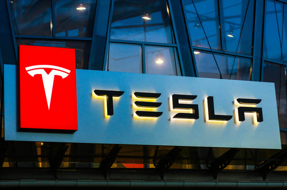 Tesla: Tesla sign on the building on car sales