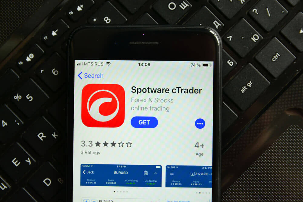 Spotware: Smartphone with mobile application Spotware cTrader.