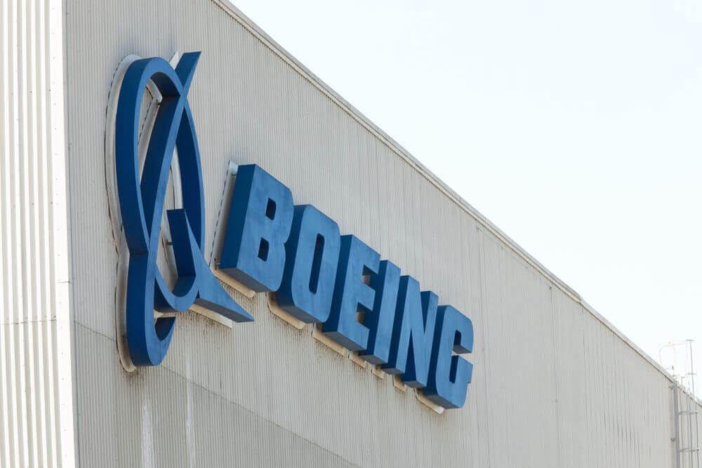 Boeing: Boeing" sign on the exterior of the 737 MAX airliner factory.