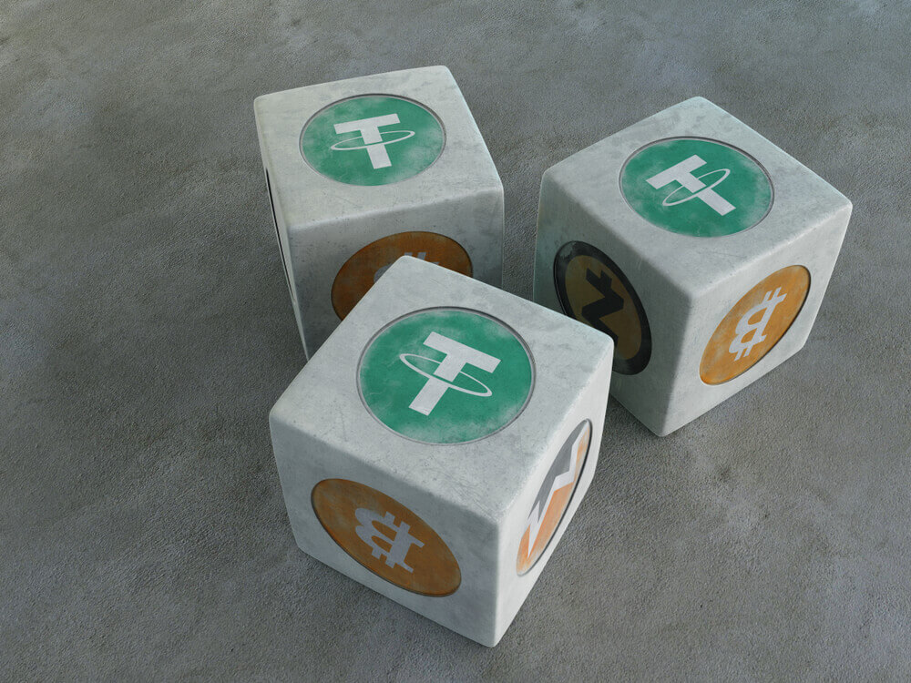 Tether. Game bones with the image of crypto currency.