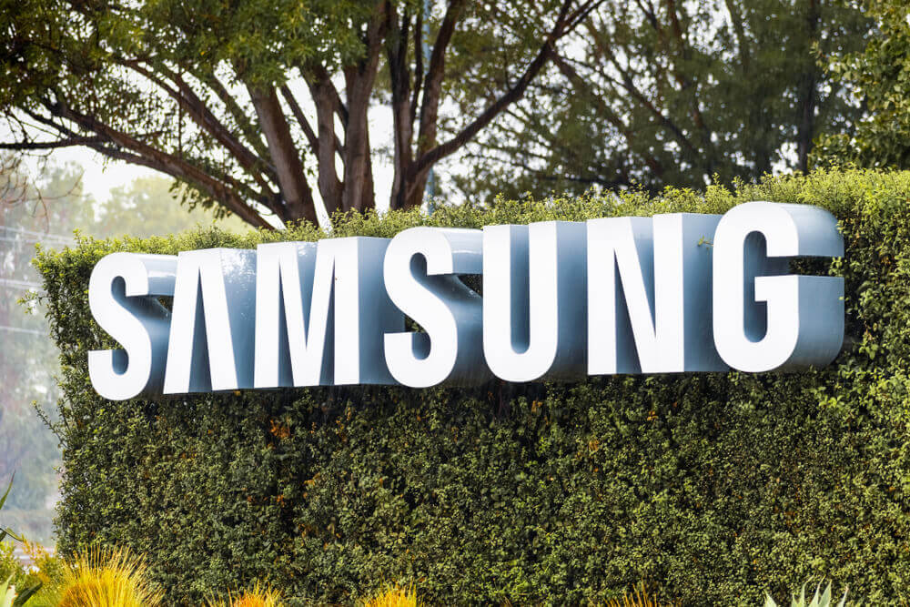 Samsung Sign displayed in front of the modern headquarters of Samsung Electronics Device Solutions America