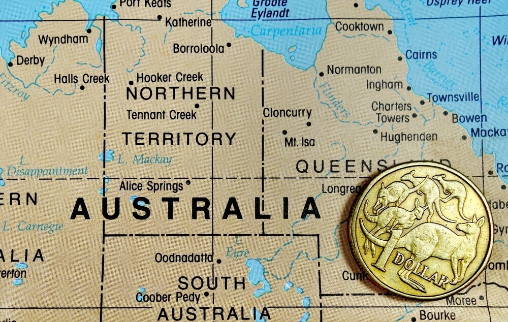 Australia map with one dollar coin