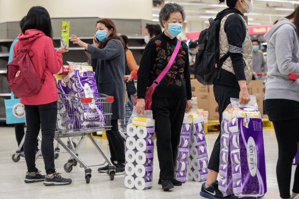 Chinese nationals doing shopping with face masks on.