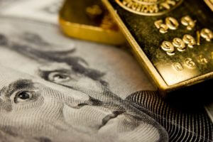 Gold Retreats as Dollar Rises