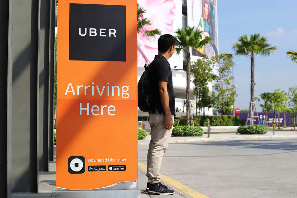 Passenger is waiting for Uber car at pick up location.