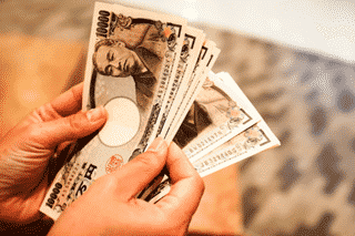 hand counting Japanese yen – Finance Brokerage
