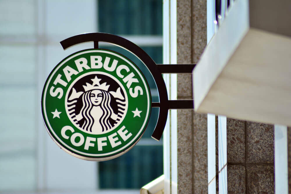 Sign Starbucks Coffee. Company signboard Starbucks Coffee.