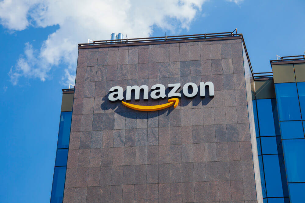 Amazon building with logo and blue sky background.
