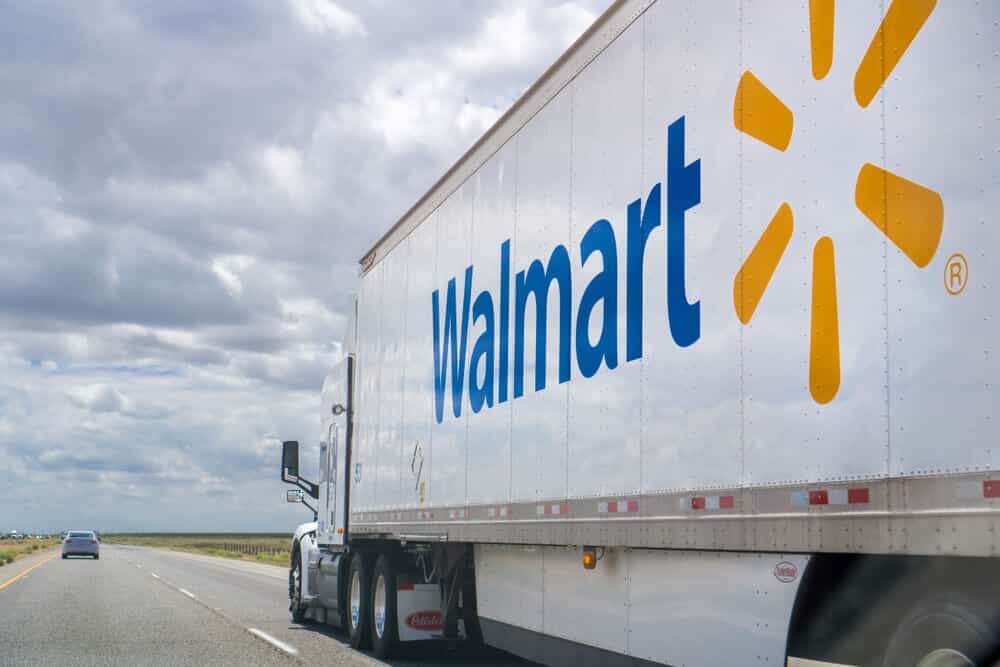 Walmart truck driving on the interstate on a cloudy day.