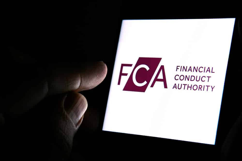 FCA Financial Conduct Authority logo on the smartphone.
