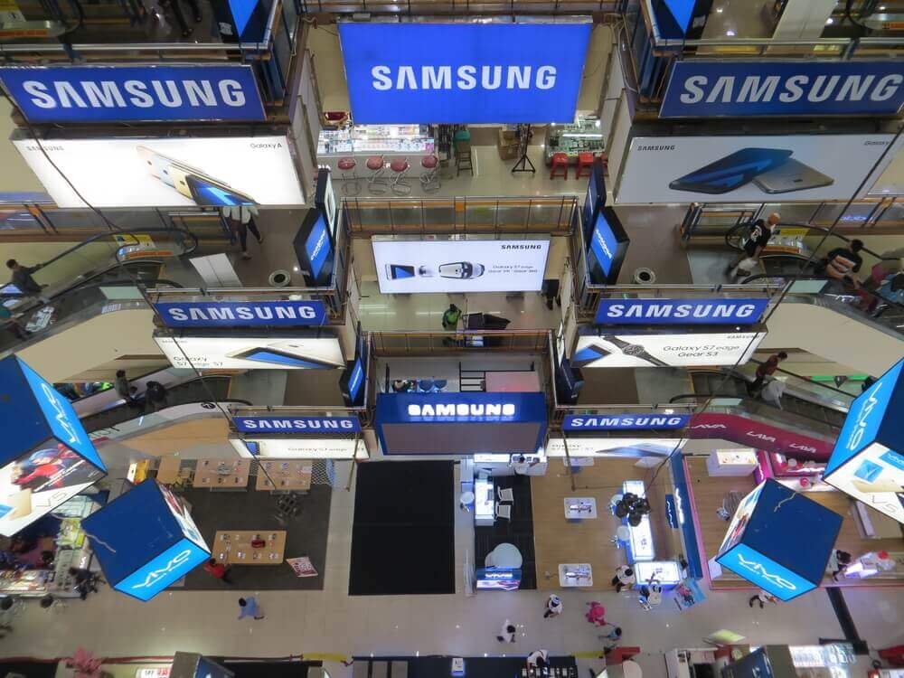 Marketplace of mobile phones with samsung logo background.