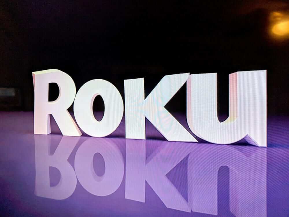 Roku Logo on TV screen.