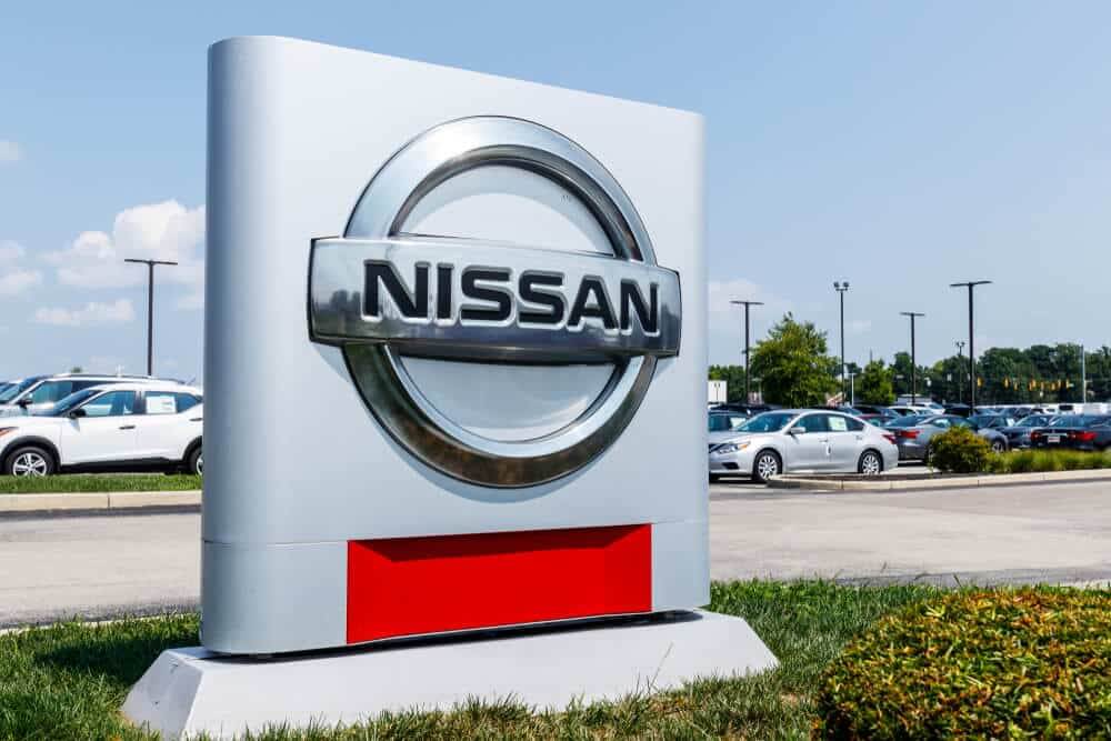 Logo and Signage of a Nissan Car and SUV Dealership.