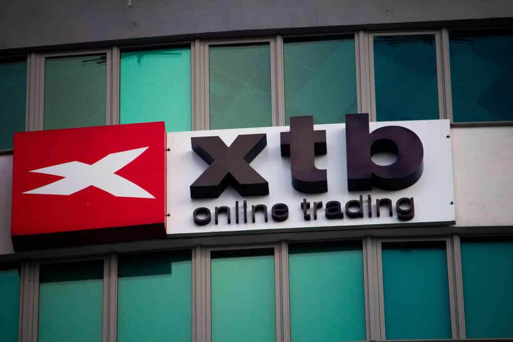 View on the XTB (X-Trade Brokers) logo on the top of office building.