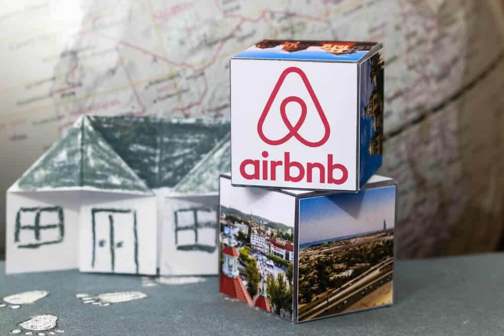 Origami Paper house. Logo Airbnb and globe.