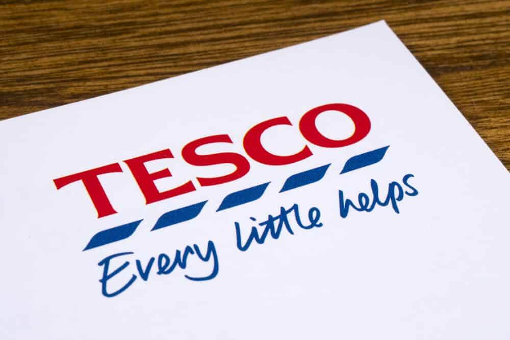 A close-up of the Tesco logo and slogan on a promotional leaflet.