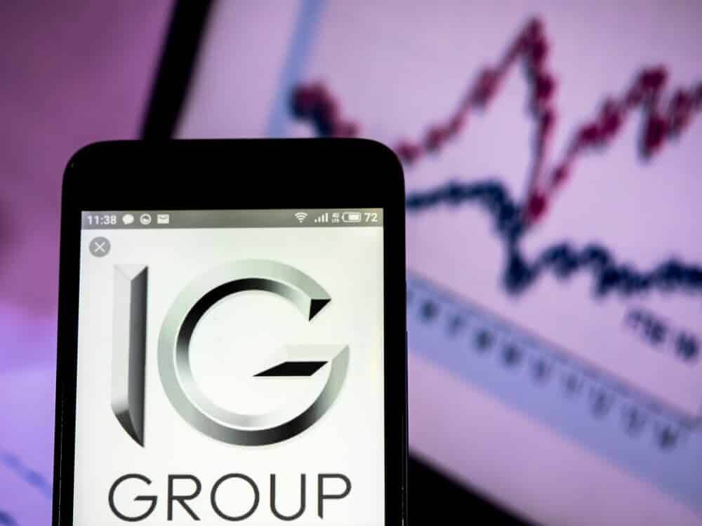 IG Group Holings plc logo seen displayed on smart phone.