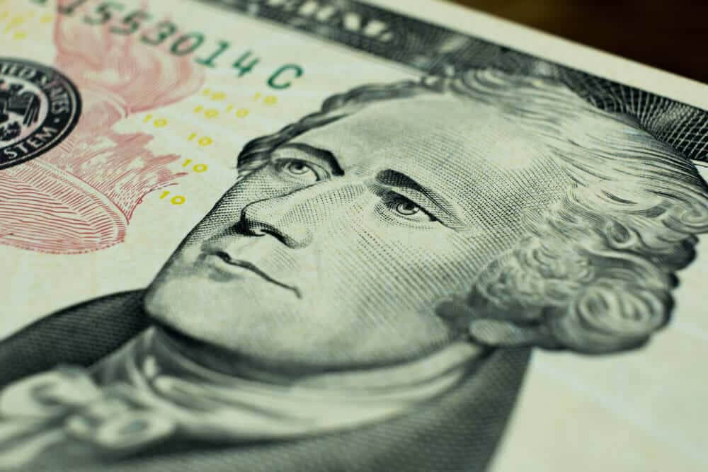 Ten dollars bill fragment of U.S. money. Macro photo.
