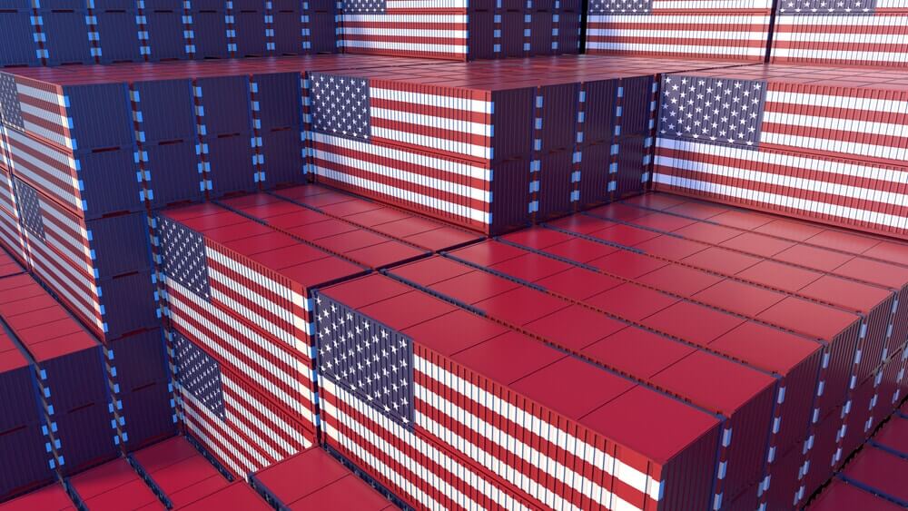 Stacked cargo containers. Flag of the United States.