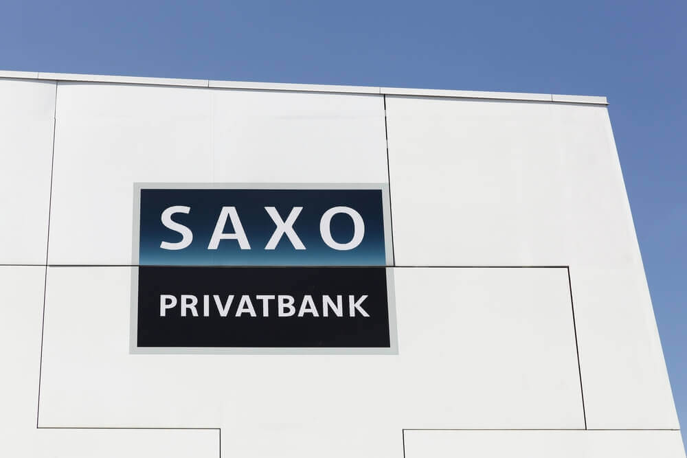 Saxo Bank logo on a wall.