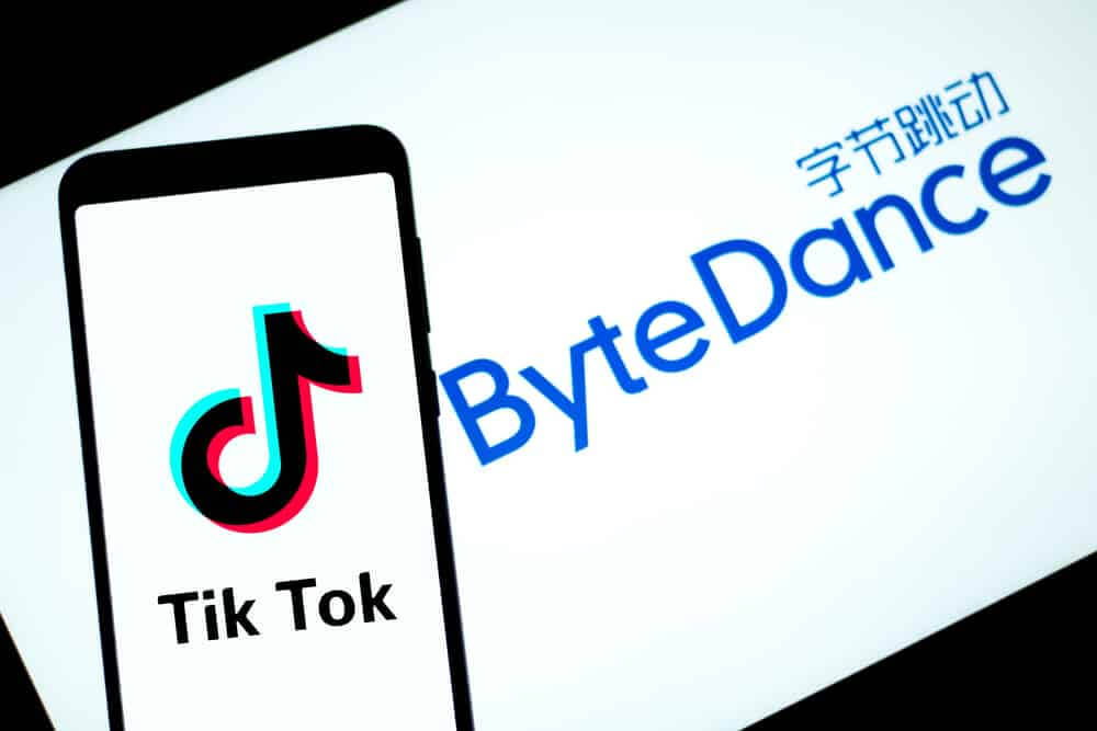 Tik Tok logo display on a smartphone with ByteDance as the background.