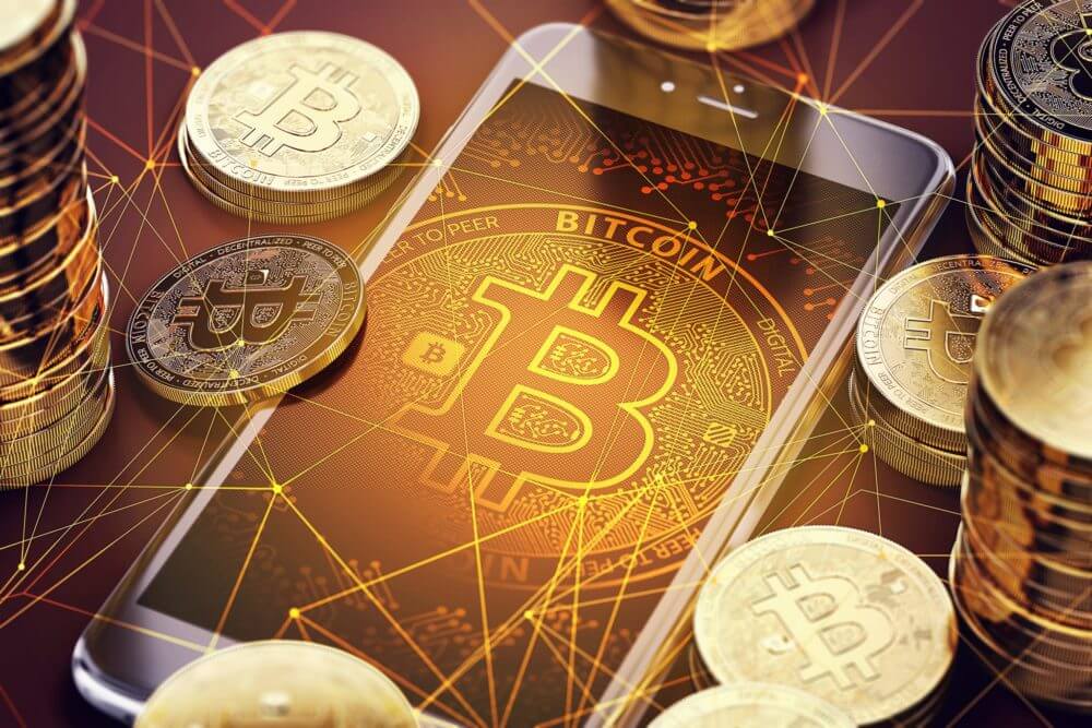 imagem de tela de celular com moedas de bitcoin