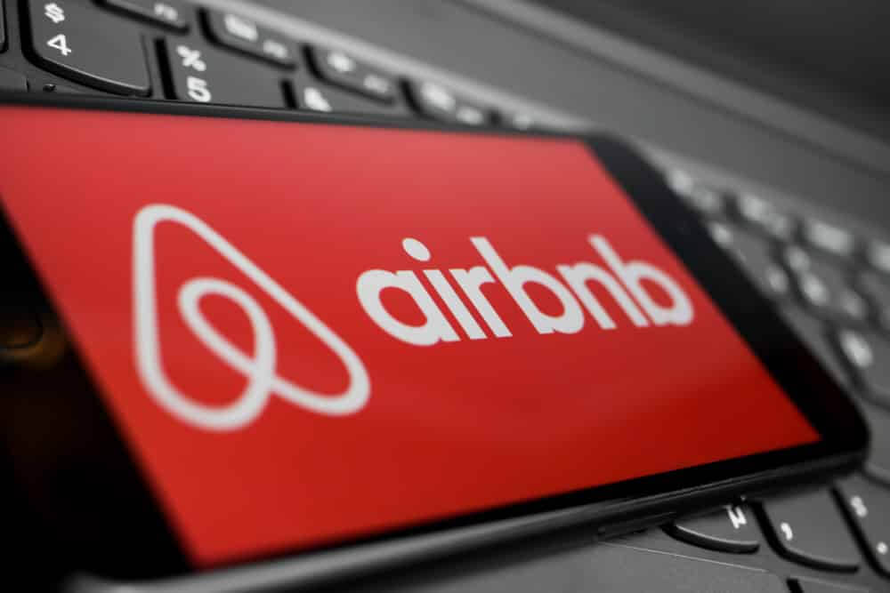 Airbnb logo on smartphone screen