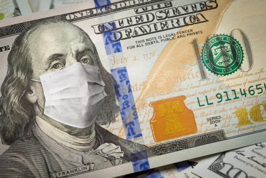 Nota de dólar com máscara